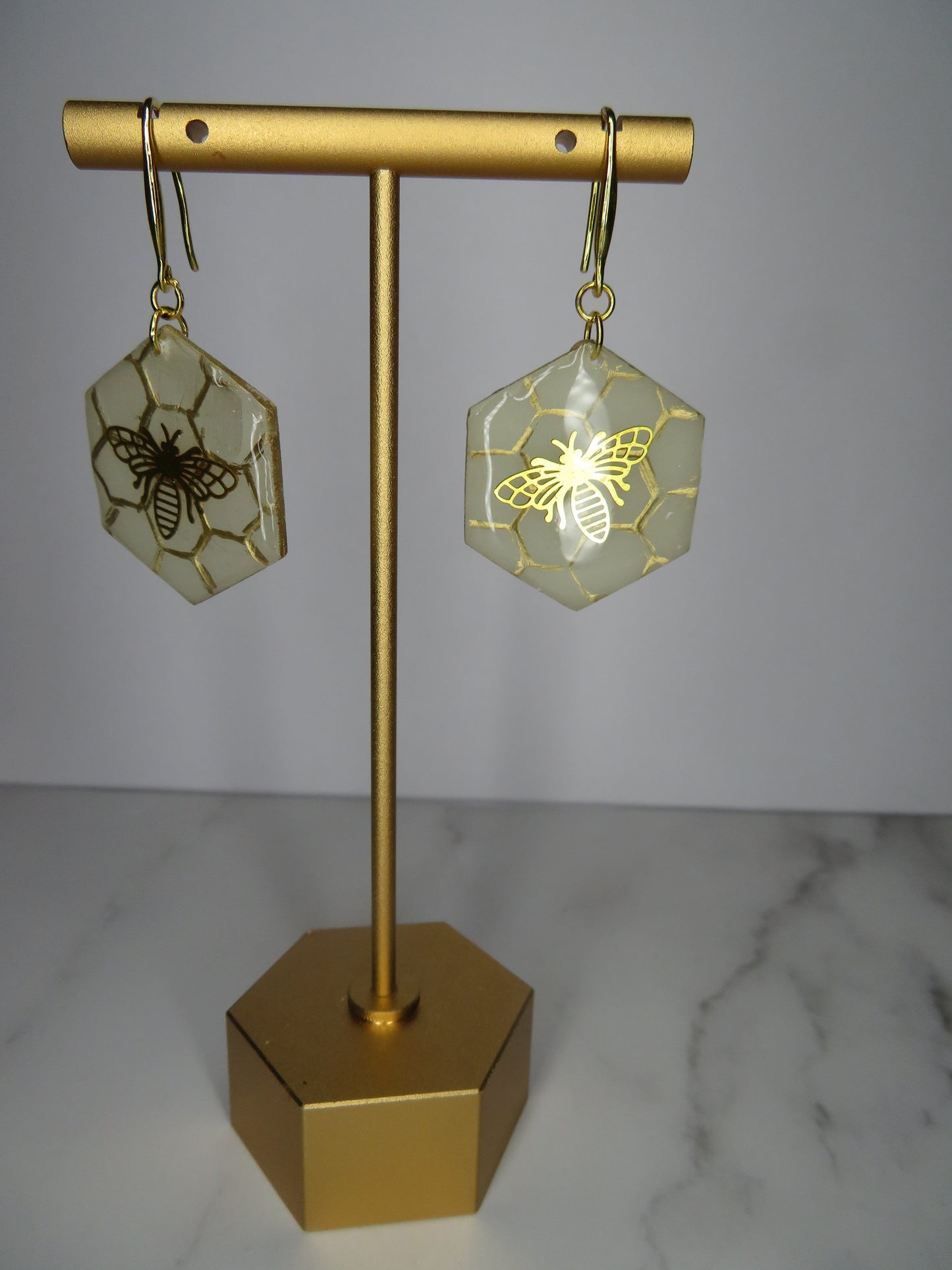 Brass bee on honeycomb earrings