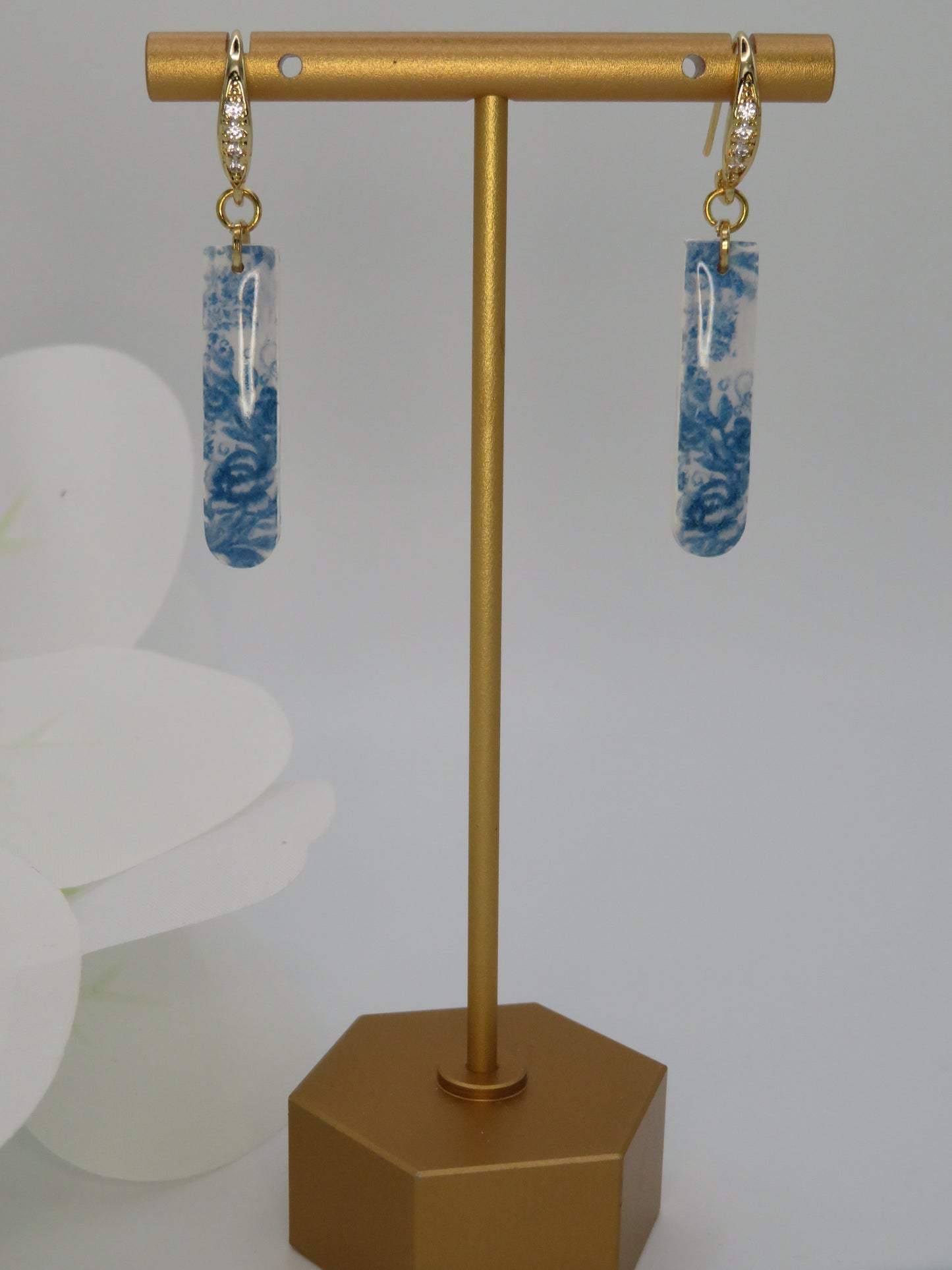 Blue and white floral dangle earrings