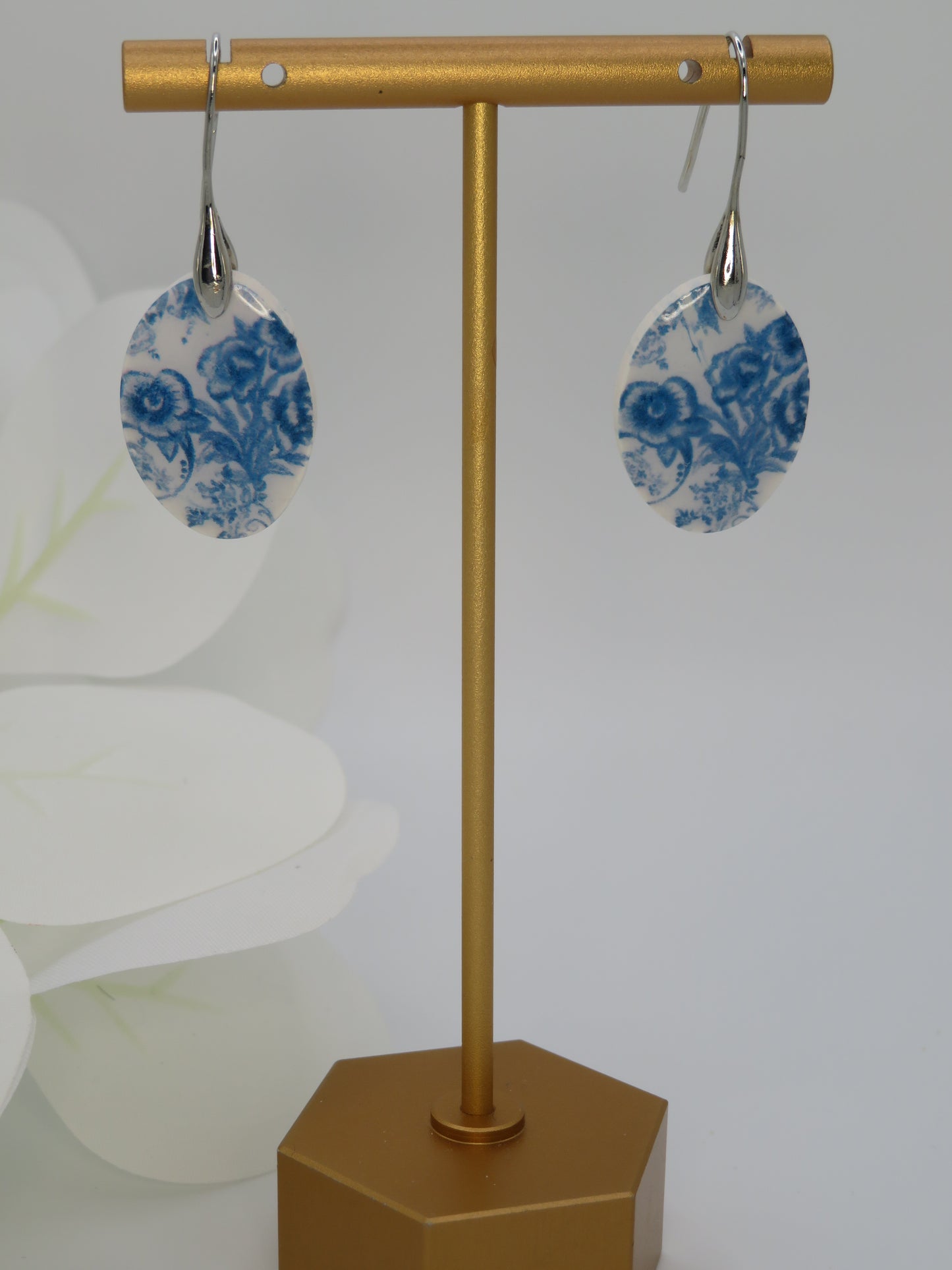 Blue and white floral dangle earrings